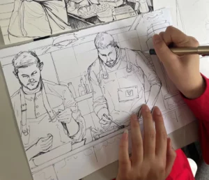 Detailed drawing of two chefs in action - brought to life with a steady hand. Creativity meets cuisine: a tribute to the craftsmanship behind the culinary delights at Hofgut Wagrain.