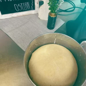 Freshly risen yeast dough in the mixing bowl - the beginning of a loving Easter pastry with tradition and craftsmanship at Hofgut Wagrain.