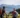 Two cyclists enjoy the view of the mountain panorama while biking around Hofgut Wagrain
