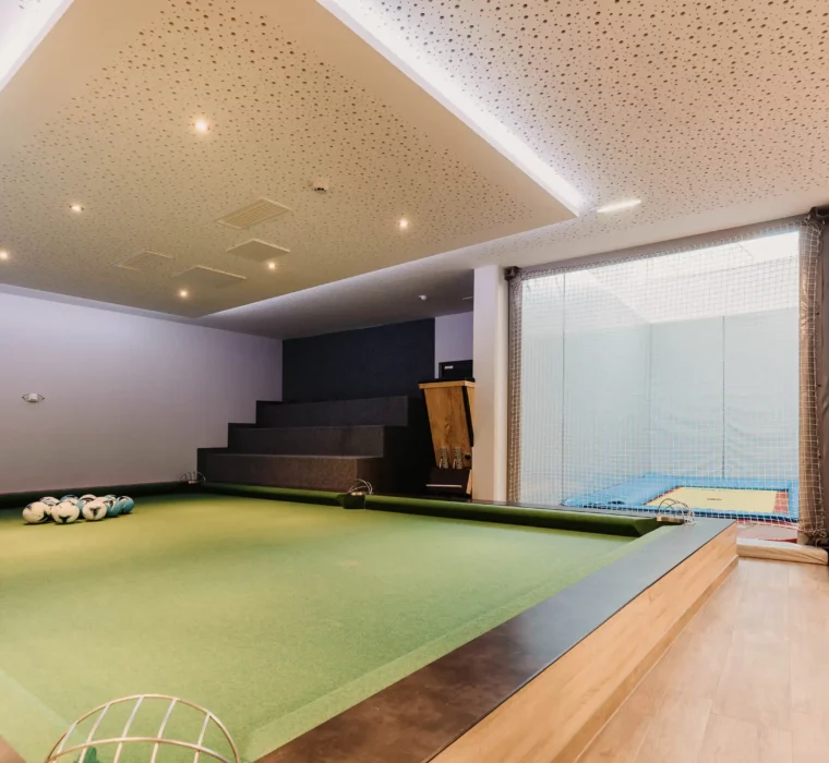 Hofgut-aparment-lifestyle-resort-wagrain-151 Giant jumbler with footballs and indoor trampolines at Hofgut Wagrain - for sporting action and unforgettable family moments.