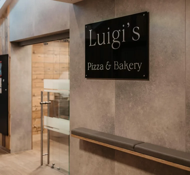 Entrance sign to Luigi's Pizza & Bakery at Hofgut Wagrain - Italian flavours right in the resort.