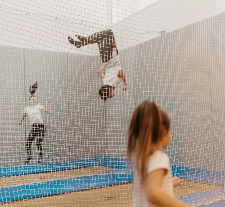 Flying high on holiday: children experience pure joie de vivre and action in the trampoline hall at Hofgut Wagrain - fun and exercise whatever the weather.