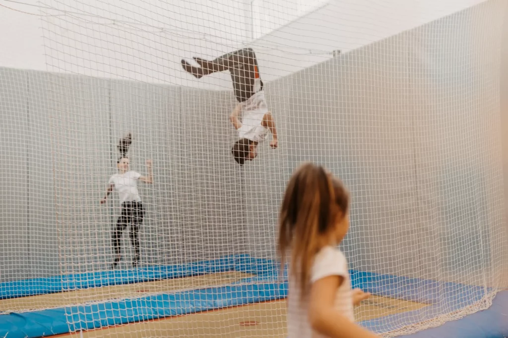 Flying high on holiday: children experience pure joie de vivre and action in the trampoline hall at Hofgut Wagrain - fun and exercise whatever the weather.
