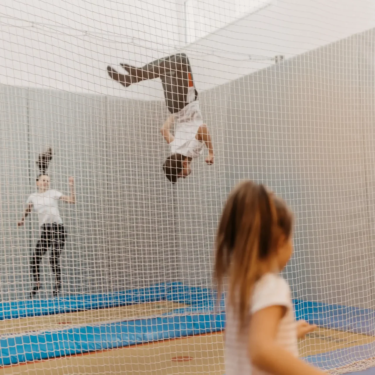 Flying high on holiday: children experience pure joie de vivre and action in the trampoline hall at Hofgut Wagrain - fun and exercise whatever the weather.