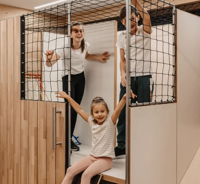 Happy children playing together in the indoor play world at Hofgut Wagrain - full of energy, laughter and a thirst for adventure.